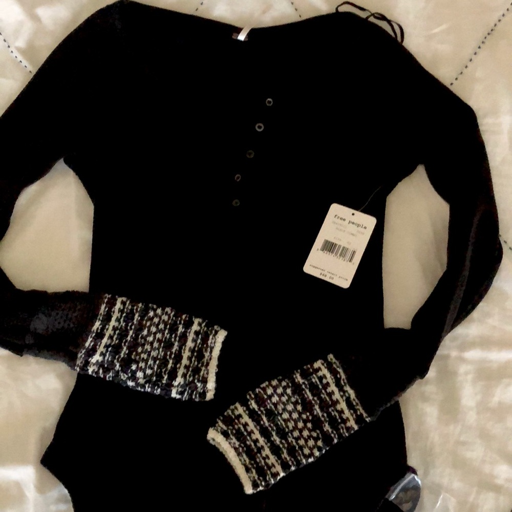Black pullover top with knit detail on the sleeves